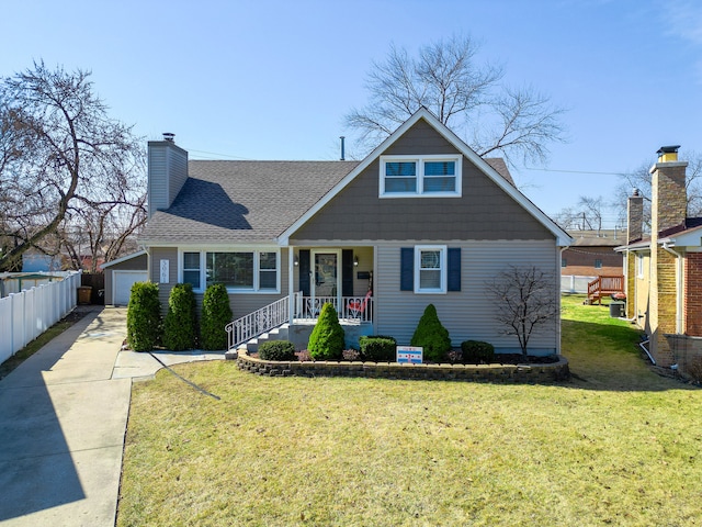 bungalow with a shingled roof, fence, a front yard, covered porch, and a chimney