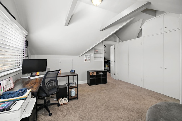 carpeted office space featuring lofted ceiling