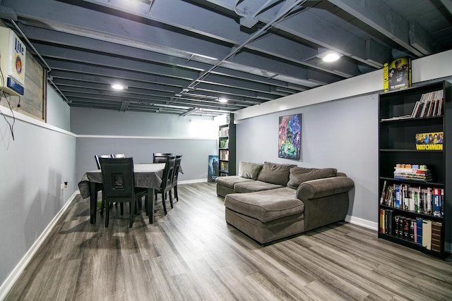 living room with baseboards and wood finished floors
