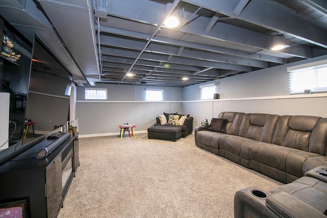 carpeted living area with baseboards