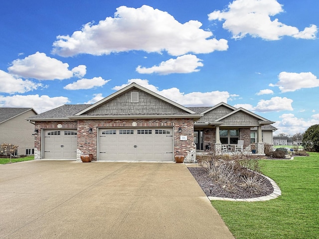 view of front facade featuring a front lawn, driveway, a porch, a garage, and brick siding