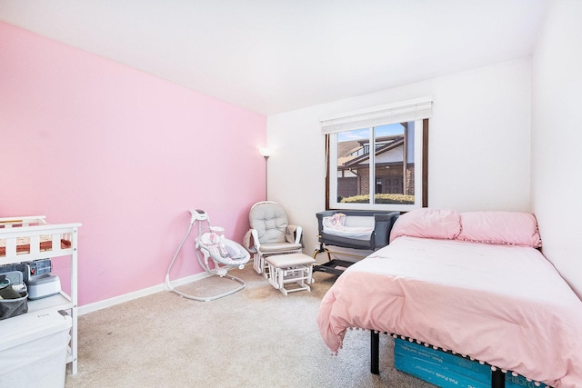 bedroom with carpet flooring and baseboards