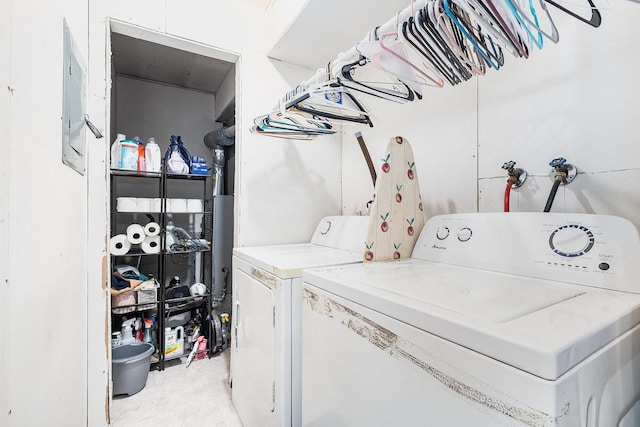 clothes washing area with washer and dryer and laundry area