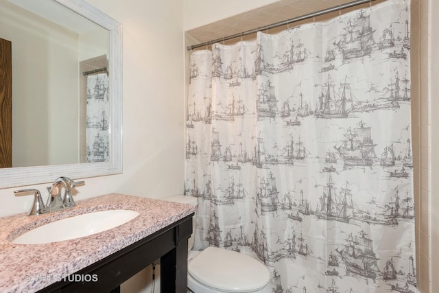 full bathroom with vanity, toilet, and a shower with curtain