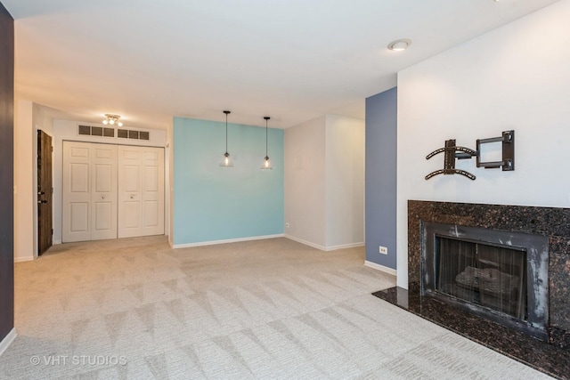 living area featuring carpet flooring, a fireplace, visible vents, and baseboards