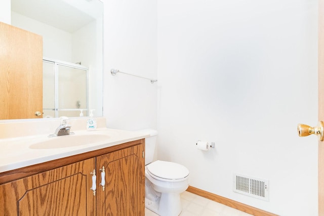 full bathroom with visible vents, toilet, a stall shower, tile patterned floors, and vanity