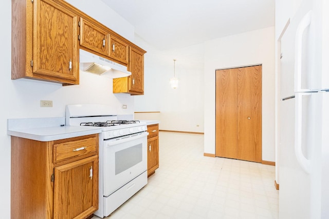 kitchen featuring under cabinet range hood, white appliances, light floors, and light countertops