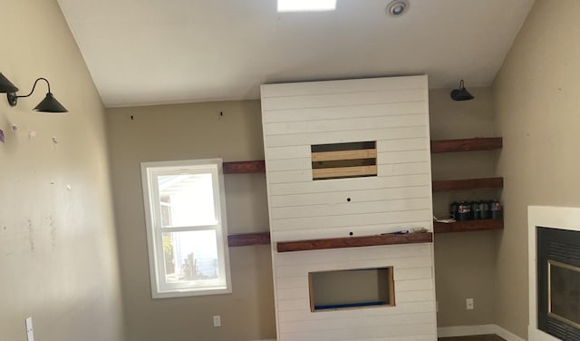 unfurnished living room featuring a fireplace