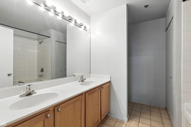1000 E 53rd St Unit 112, Chicago, IL 60615 - full bath with double vanity, tile patterned floors, and bathtub / shower combination