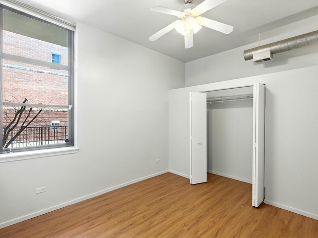 1000 E 53rd St Unit 112, Chicago, IL 60615 - unfurnished bedroom featuring light wood-type flooring, a closet, and ceiling fan