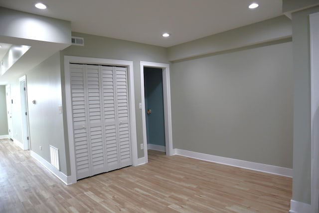 interior space with recessed lighting, visible vents, baseboards, and light wood finished floors