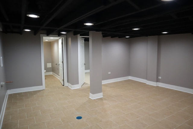 finished basement featuring baseboards