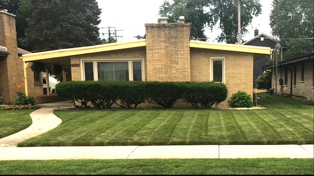 view of property exterior with a yard and a chimney