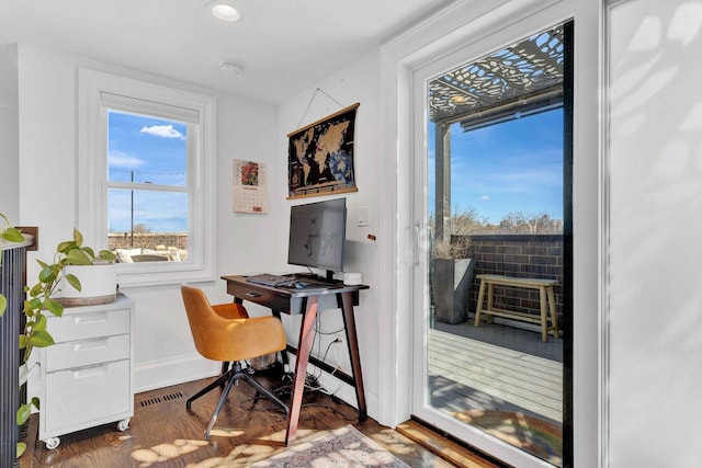 office area with baseboards, recessed lighting, wood finished floors, and visible vents