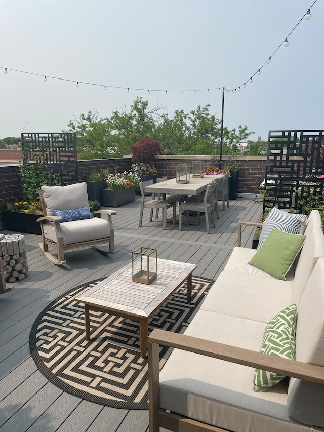 deck with outdoor dining space