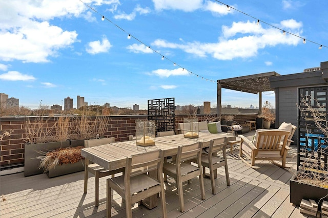 wooden terrace with outdoor dining area