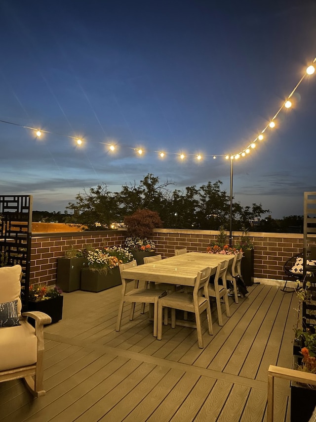 deck featuring outdoor dining area