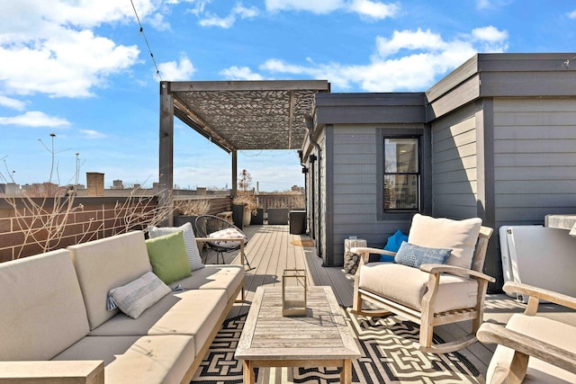 view of patio / terrace with outdoor lounge area, a fenced backyard, and a wooden deck