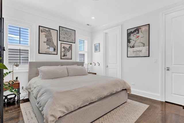 bedroom featuring recessed lighting, dark wood-style flooring, baseboards, visible vents, and crown molding