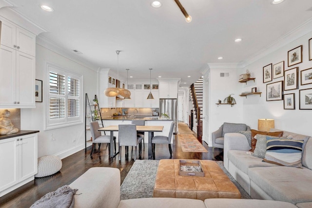 living area featuring visible vents, recessed lighting, and dark wood-type flooring