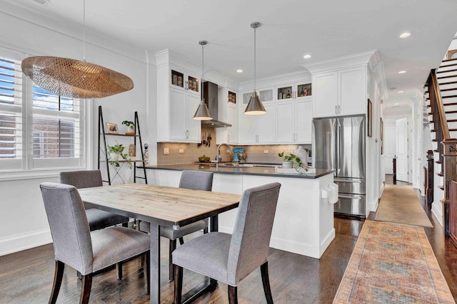 dining area with recessed lighting, baseboards, and dark wood-type flooring