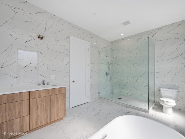 bathroom featuring a soaking tub, stone wall, toilet, and marble finish floor