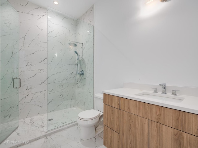 full bath with a marble finish shower, toilet, marble finish floor, and vanity