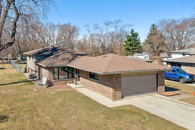 view of front of home featuring brick siding, a front lawn, concrete driveway, roof with shingles, and a garage