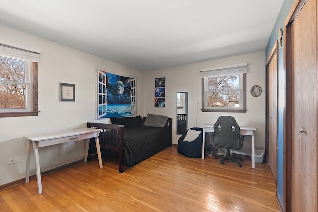 bedroom with light wood-style floors