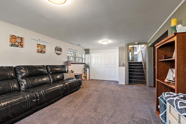 carpeted living area featuring stairway and crown molding