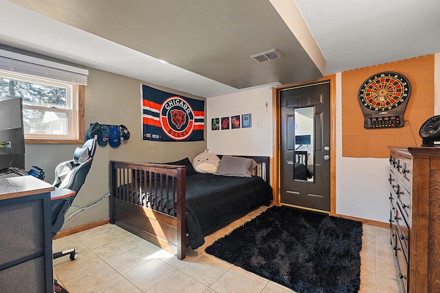 tiled bedroom featuring visible vents and baseboards