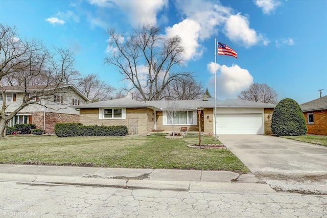 view of front facade featuring a garage, driveway, and a front lawn