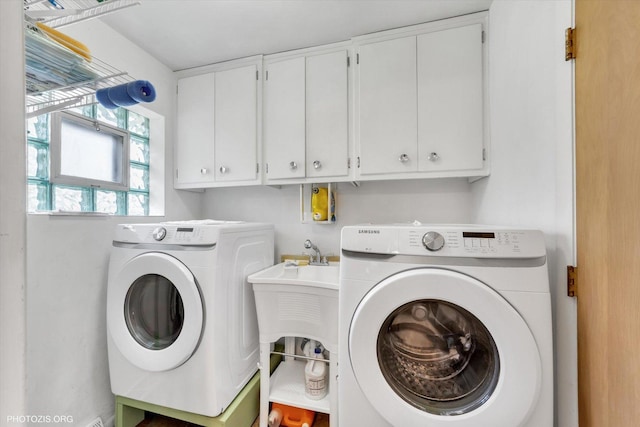 laundry area featuring cabinet space and independent washer and dryer