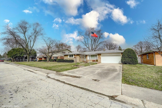 view of front of property with a front lawn, an attached garage, and concrete driveway