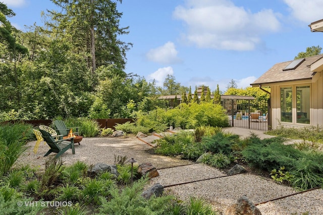 view of yard featuring fence and a patio