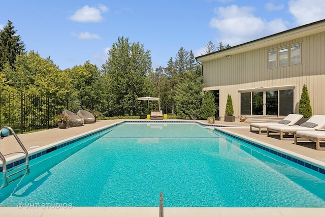 view of pool featuring a fenced in pool and a patio