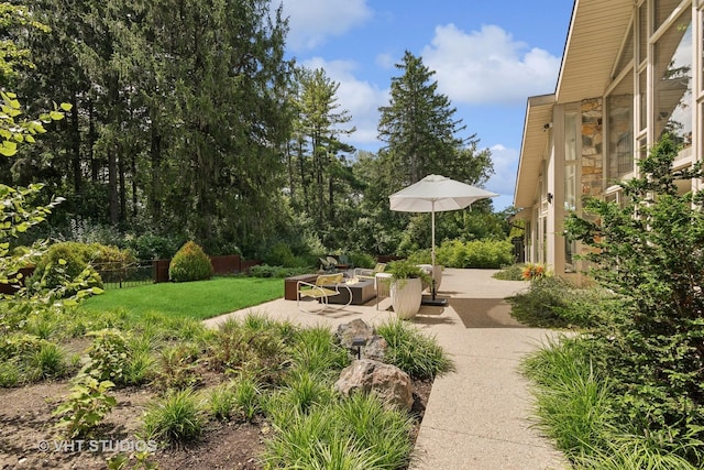 view of yard with fence and a patio area