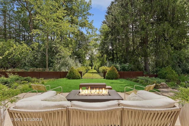 view of patio featuring a fenced backyard and an outdoor fire pit