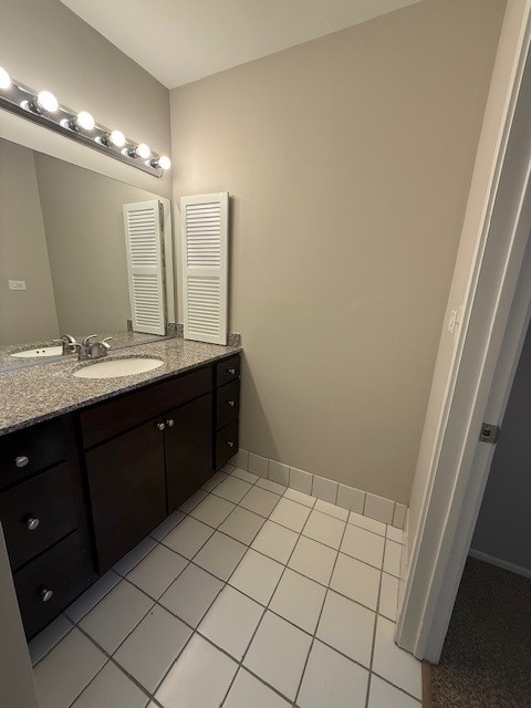 bathroom with vanity and tile patterned flooring