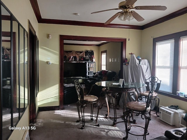 dining room with an AC wall unit, a ceiling fan, carpet floors, and ornamental molding