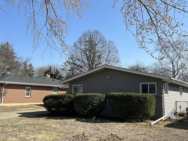 view of property exterior featuring brick siding