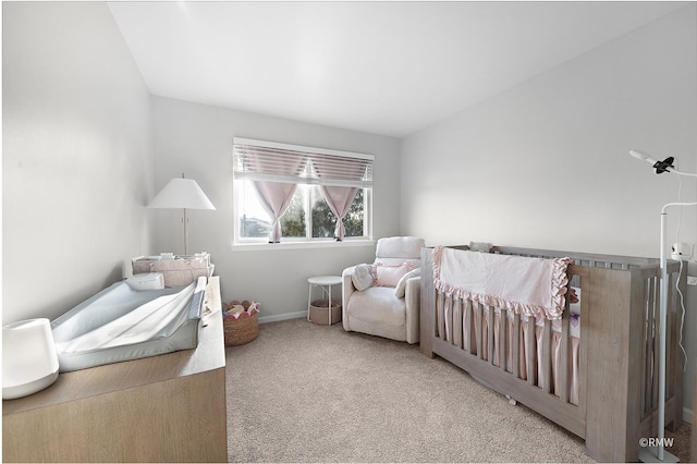 bedroom featuring baseboards and carpet floors