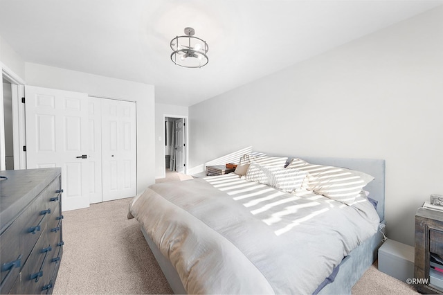 bedroom featuring a closet and carpet