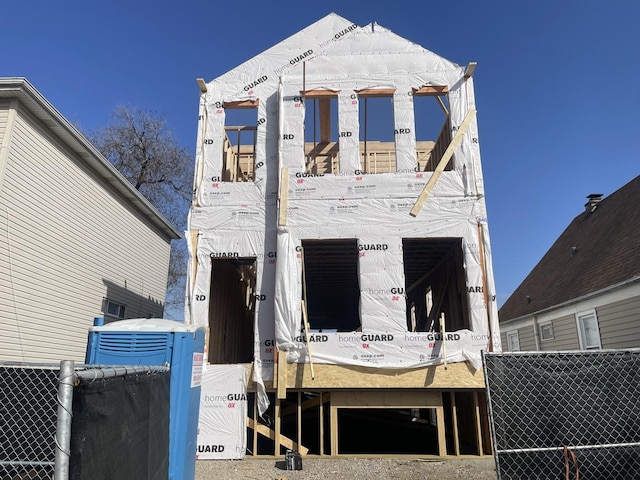 view of front of house with fence