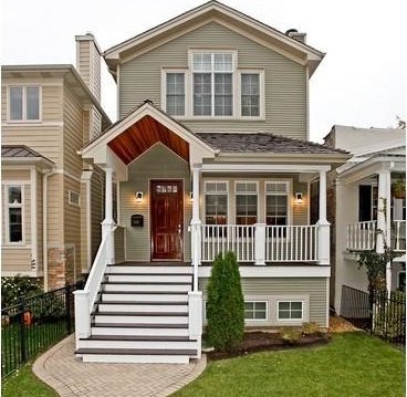 view of front of home featuring a porch, a front lawn, and fence