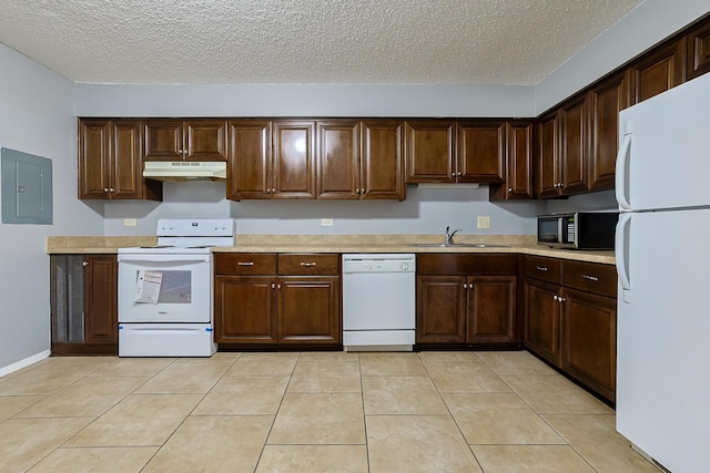 kitchen with under cabinet range hood, light countertops, electric panel, white appliances, and a sink