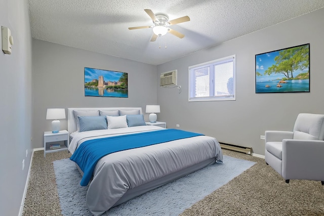 carpeted bedroom featuring a baseboard heating unit, baseboards, a wall unit AC, a textured ceiling, and a ceiling fan