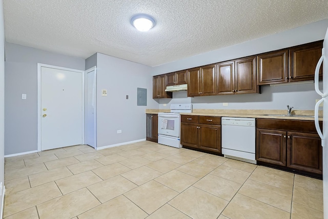 kitchen with under cabinet range hood, electric panel, a sink, white appliances, and light countertops