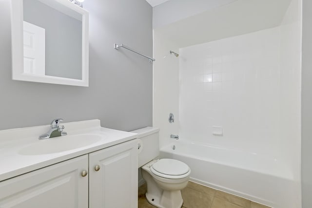 bathroom with vanity, tile patterned floors, toilet, and washtub / shower combination