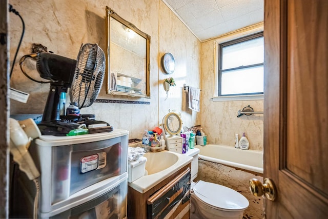 full bathroom with a bathtub, toilet, and vanity